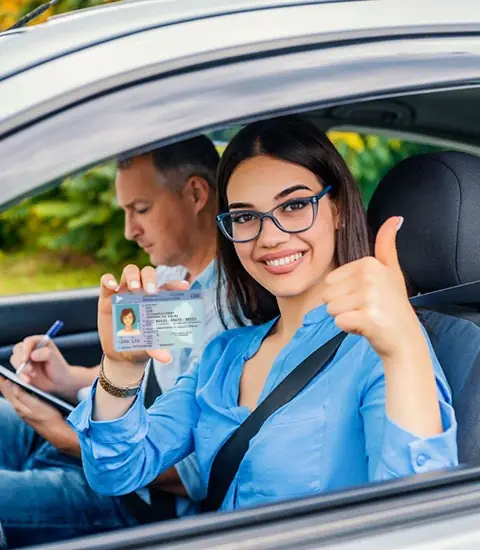 Student driver showing her new Ontario driver's licence