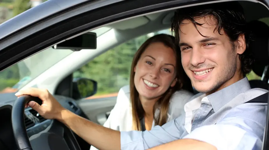Newcomer to Canada taking a driving lesson